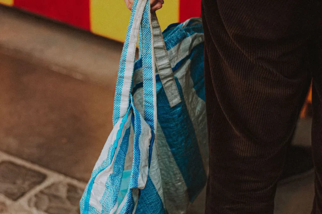 Reusable tote bag carried on the street, sustainable corporate gift idea