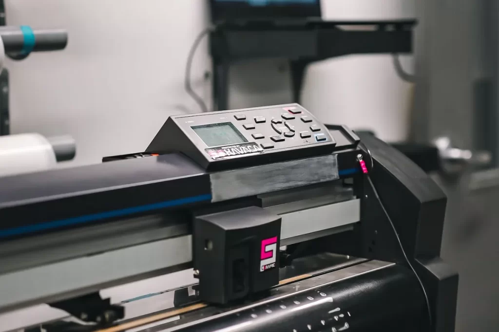 Large format printer producing wide prints in a print studio