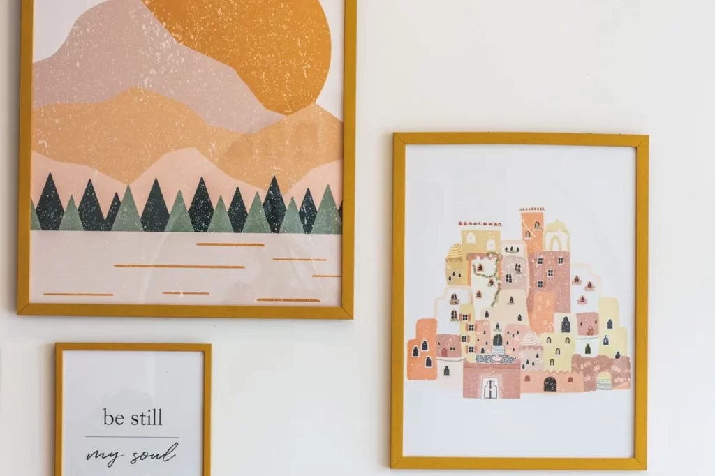 Framed high-resolution poster prints mounted on a white wall